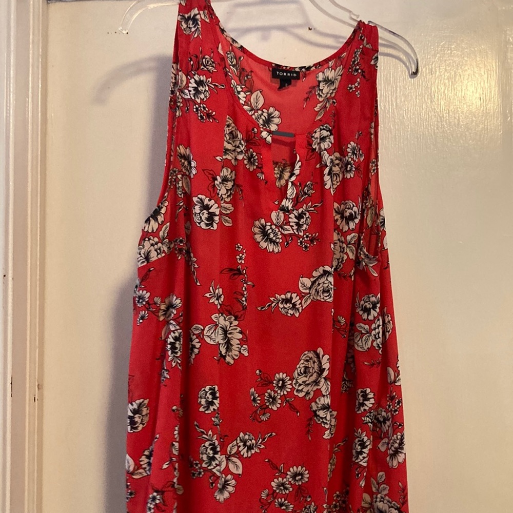 Sleeveless red blouse